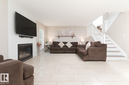 29 Haney Landing, Spruce Grove, AB - Indoor Photo Showing Living Room With Fireplace