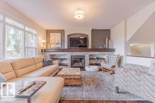 1019 Coopers Hawk Link Link, Edmonton, AB - Indoor Photo Showing Living Room With Fireplace