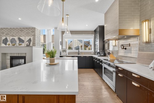 7 Jubilation Drive, St. Albert, AB - Indoor Photo Showing Kitchen With Fireplace With Upgraded Kitchen