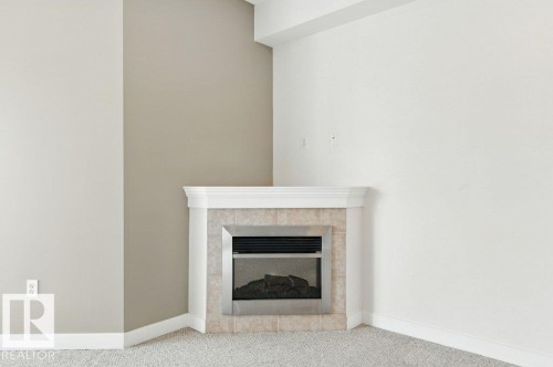308 8931 156 Street, Edmonton, AB - Indoor Photo Showing Living Room With Fireplace