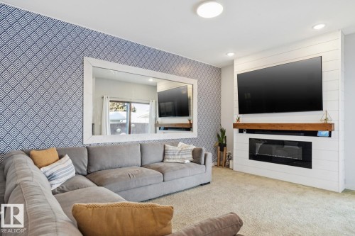 6412 36 Avenue, Edmonton, AB - Indoor Photo Showing Living Room With Fireplace