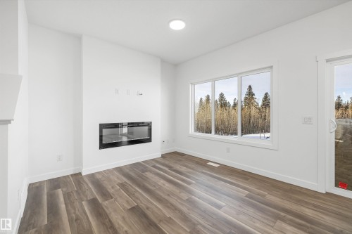 4180 Kinglet Drive, Edmonton, AB - Indoor Photo Showing Living Room With Fireplace