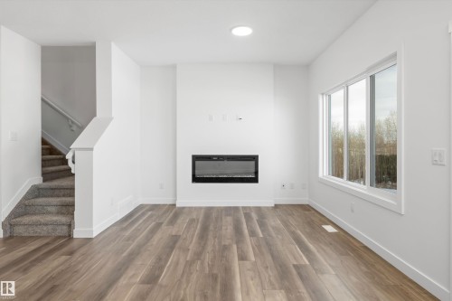 4180 Kinglet Drive, Edmonton, AB - Indoor Photo Showing Other Room With Fireplace