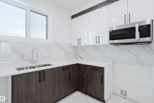 4119 67 Street, Beaumont, AB - Indoor Photo Showing Kitchen With Double Sink With Upgraded Kitchen