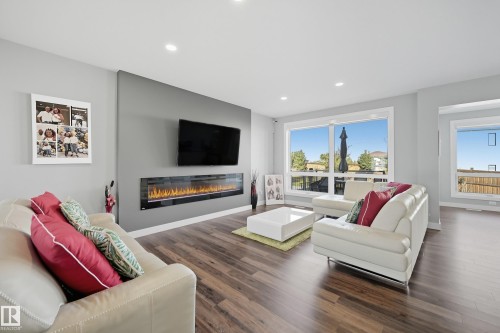 1487 Howes Crescent Sw, Edmonton, AB - Indoor Photo Showing Living Room With Fireplace