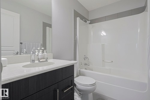 Bathroom featuring vanity and washtub / shower combination - 407 812 Welsh Drive, Edmonton, AB - Indoor Photo Showing Bathroom