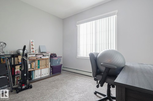 Carpeted office featuring baseboard heating - 407 812 Welsh Drive, Edmonton, AB - Indoor Photo Showing Office