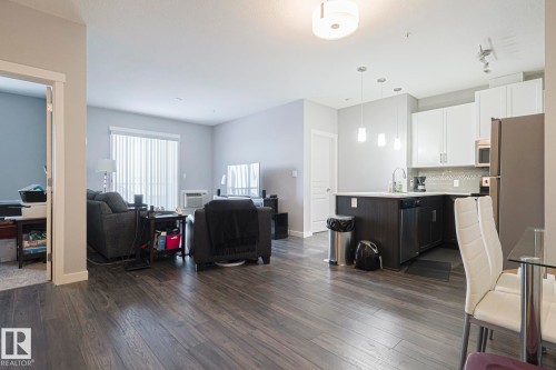 Living area featuring dark wood-style flooring - 407 812 Welsh Drive, Edmonton, AB - Indoor