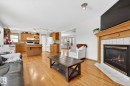 4027 31 Street, Edmonton, AB  - Indoor Photo Showing Living Room With Fireplace 