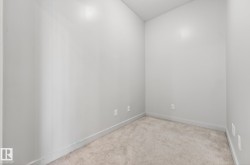 Unfurnished room with carpet and baseboards - 