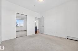 Unfurnished bedroom featuring a closet and light carpet - 