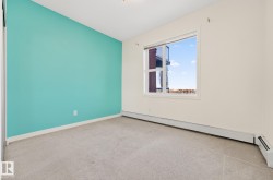 Spare room with carpet flooring and baseboard heating - 