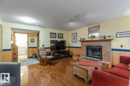 4631 10 Avenue, Edmonton, AB - Indoor Photo Showing Living Room With Fireplace
