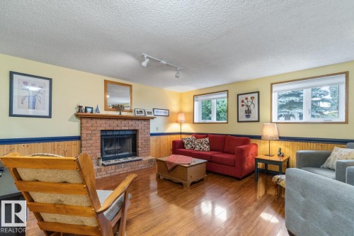 4631 10 Avenue, Edmonton, AB - Indoor Photo Showing Living Room With Fireplace