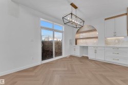 Unfurnished dining area featuring baseboards and a chandelier - 