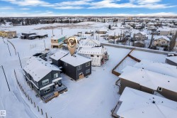 Snowy aerial view featuring a residential view - 