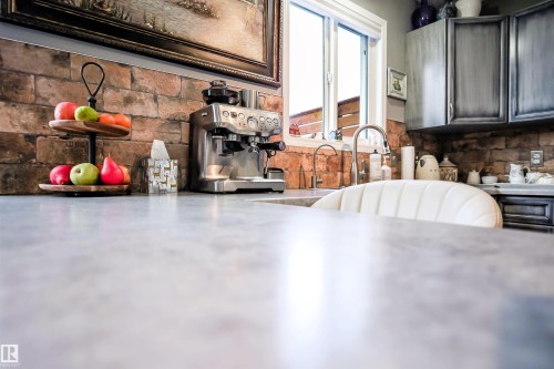 Kitchen view of a sink and light countertops - 5836 204 Street, Edmonton, AB - Indoor