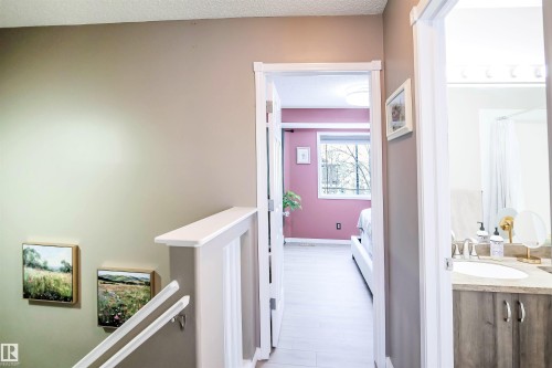 Corridor with an upstairs landing and a textured ceiling - 5836 204 Street, Edmonton, AB - Indoor Photo Showing Other Room