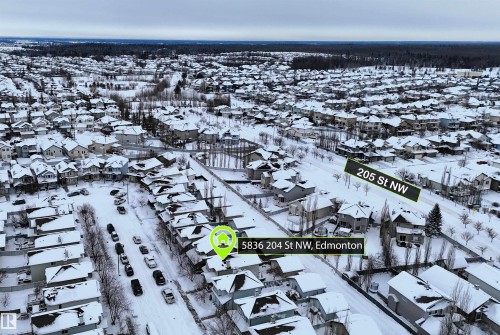 Snowy aerial view featuring a residential view - 5836 204 Street, Edmonton, AB - Outdoor With View