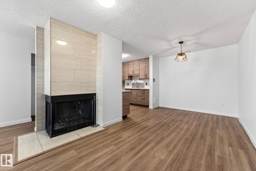 135 Surrey Gardens, Edmonton, AB - Indoor Photo Showing Other Room With Fireplace