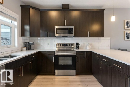 69 Joyal Way, St. Albert, AB - Indoor Photo Showing Kitchen With Double Sink With Upgraded Kitchen
