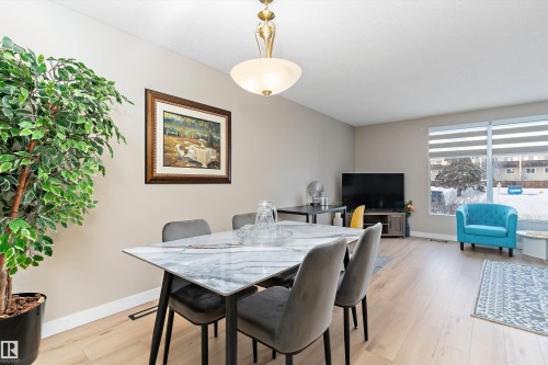 Dining room featuring light wood finished floors and baseboards - 17107 86 Avenue Nw, Edmonton, AB - Indoor Photo Showing Dining Room