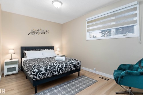 Bedroom featuring light wood-style floors and baseboards - 17107 86 Avenue Nw, Edmonton, AB - Indoor Photo Showing Bedroom