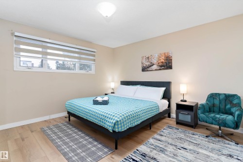 Bedroom with baseboards and wood finished floors - 17107 86 Avenue Nw, Edmonton, AB - Indoor Photo Showing Bedroom