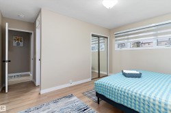 Bedroom featuring light wood finished floors and a closet - 