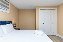 Bedroom featuring light wood-style floors and a closet - 
