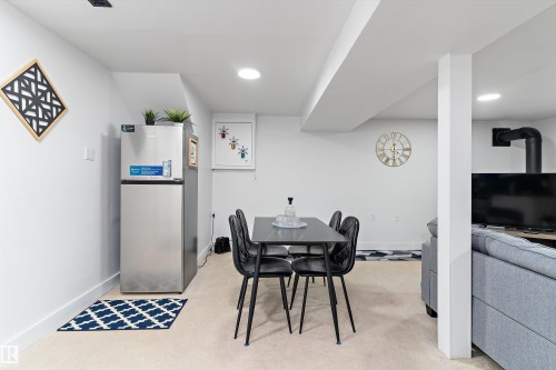 Dining space with a wood stove and recessed lighting - 17107 86 Avenue Nw, Edmonton, AB - Indoor