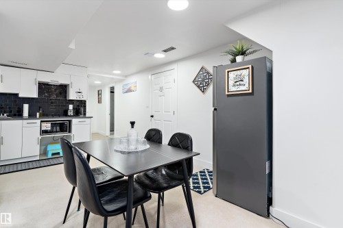 Dining space with recessed lighting and wet bar - 17107 86 Avenue Nw, Edmonton, AB - Indoor