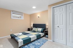 Bedroom with carpet flooring and a closet - 