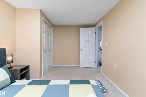 Bedroom with a closet and light carpet - 17107 86 Avenue Nw, Edmonton, AB - Indoor