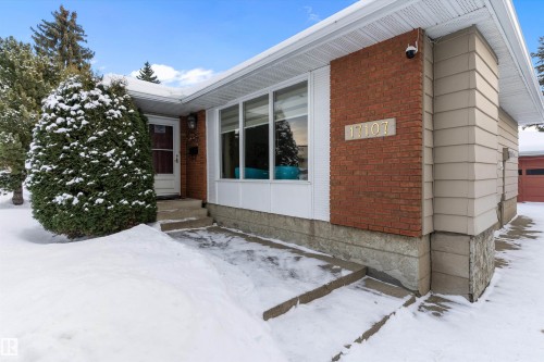 Snow covered property entrance with brick siding - 17107 86 Avenue Nw, Edmonton, AB - Outdoor