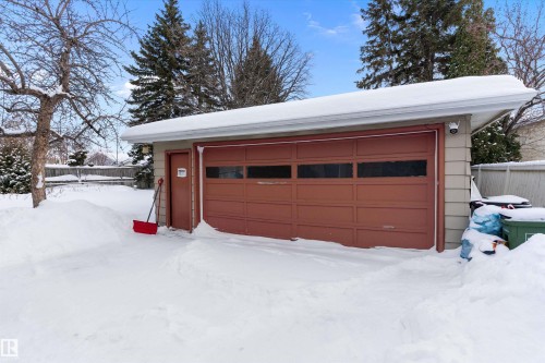 Snow covered garage featuring a garage - 17107 86 Avenue Nw, Edmonton, AB - Outdoor