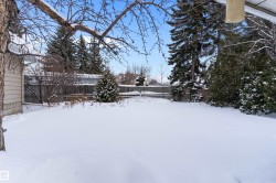 Yard covered in snow featuring a fenced backyard - 