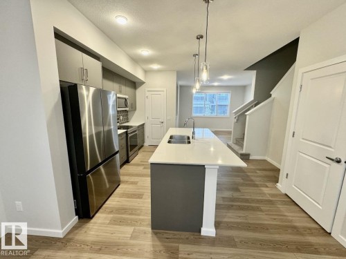 126 Stiles Bend, Leduc, AB - Indoor Photo Showing Kitchen With Double Sink