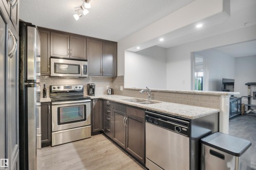 264 11517 Ellerslie Road, Edmonton, AB - Indoor Photo Showing Kitchen With Stainless Steel Kitchen With Double Sink