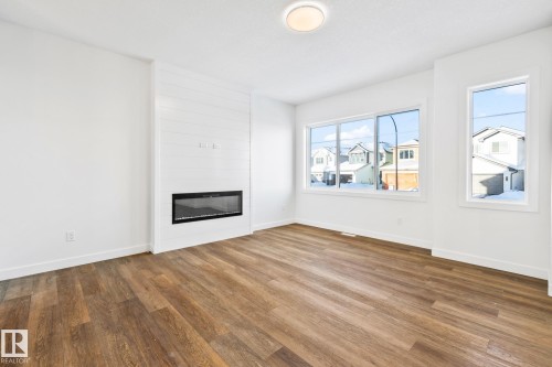 65 Ficus Way, Fort Saskatchewan, AB - Indoor Photo Showing Living Room With Fireplace
