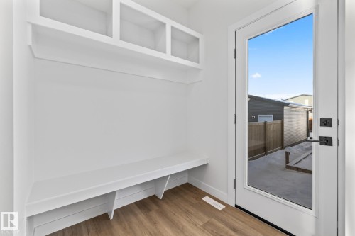 Mudroom with light wood-style flooring and baseboards - 206 Starling, Fort Saskatchewan, AB - Indoor Photo Showing Other Room