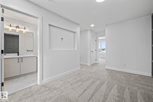 Spare room featuring light carpet and recessed lighting - 206 Starling, Fort Saskatchewan, AB - Indoor Photo Showing Other Room