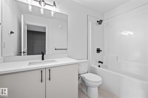 Bathroom featuring shower / washtub combination and vanity - 206 Starling, Fort Saskatchewan, AB - Indoor Photo Showing Bathroom