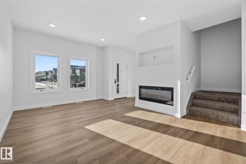 206 Starling, Fort Saskatchewan, AB - Indoor Photo Showing Living Room With Fireplace