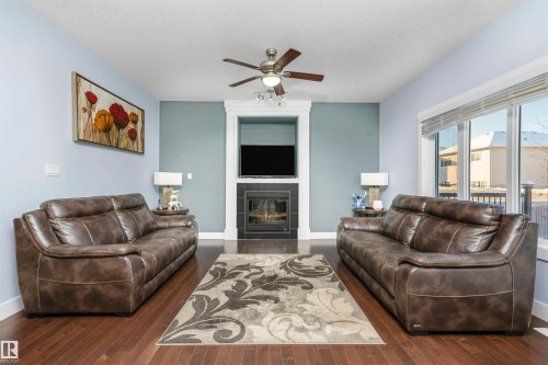 6014 60 Street, Beaumont, AB - Indoor Photo Showing Living Room With Fireplace