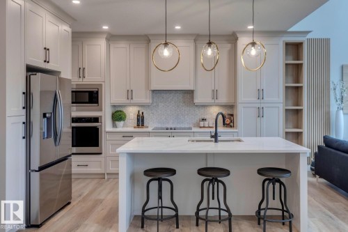 3612 Triomphe Boulevard, Beaumont, AB - Indoor Photo Showing Kitchen With Stainless Steel Kitchen With Upgraded Kitchen