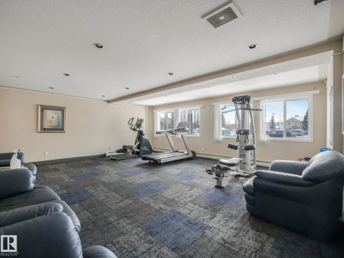 210 245 Edwards Drive, Edmonton, AB - Indoor Photo Showing Gym Room