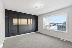Empty room with light carpet and baseboards - 