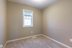 bedroom featuring baseboards and carpet floors - 