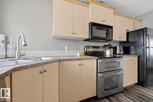 5851 Sutter Place, Edmonton, AB - Indoor Photo Showing Kitchen With Double Sink